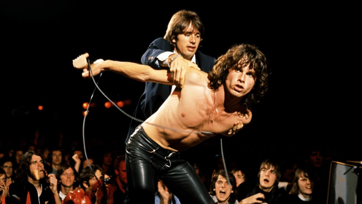 56 Years Ago Today, an Indecent Proposal Led to Jim Morrison Being Yanked Offstage by Doors Bandmate