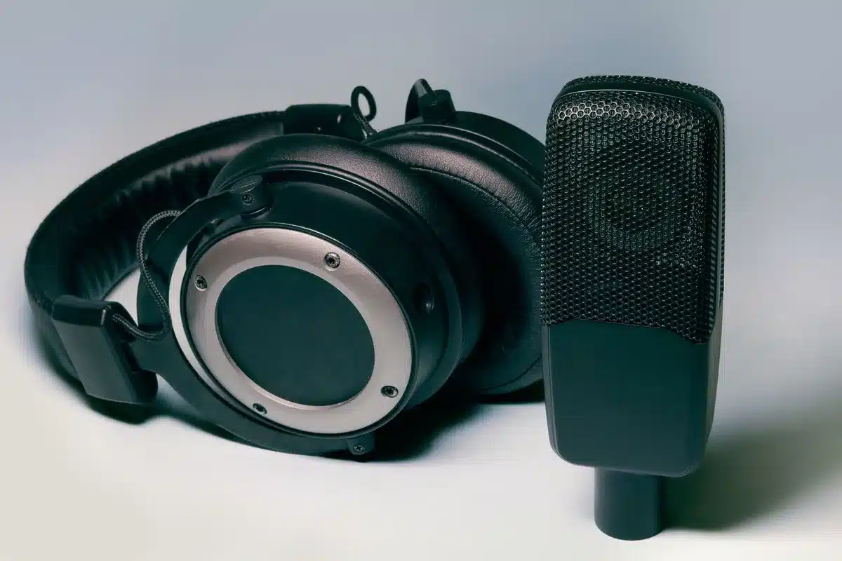 Professional podcast recording studio with microphone, headphones, and sound equipment