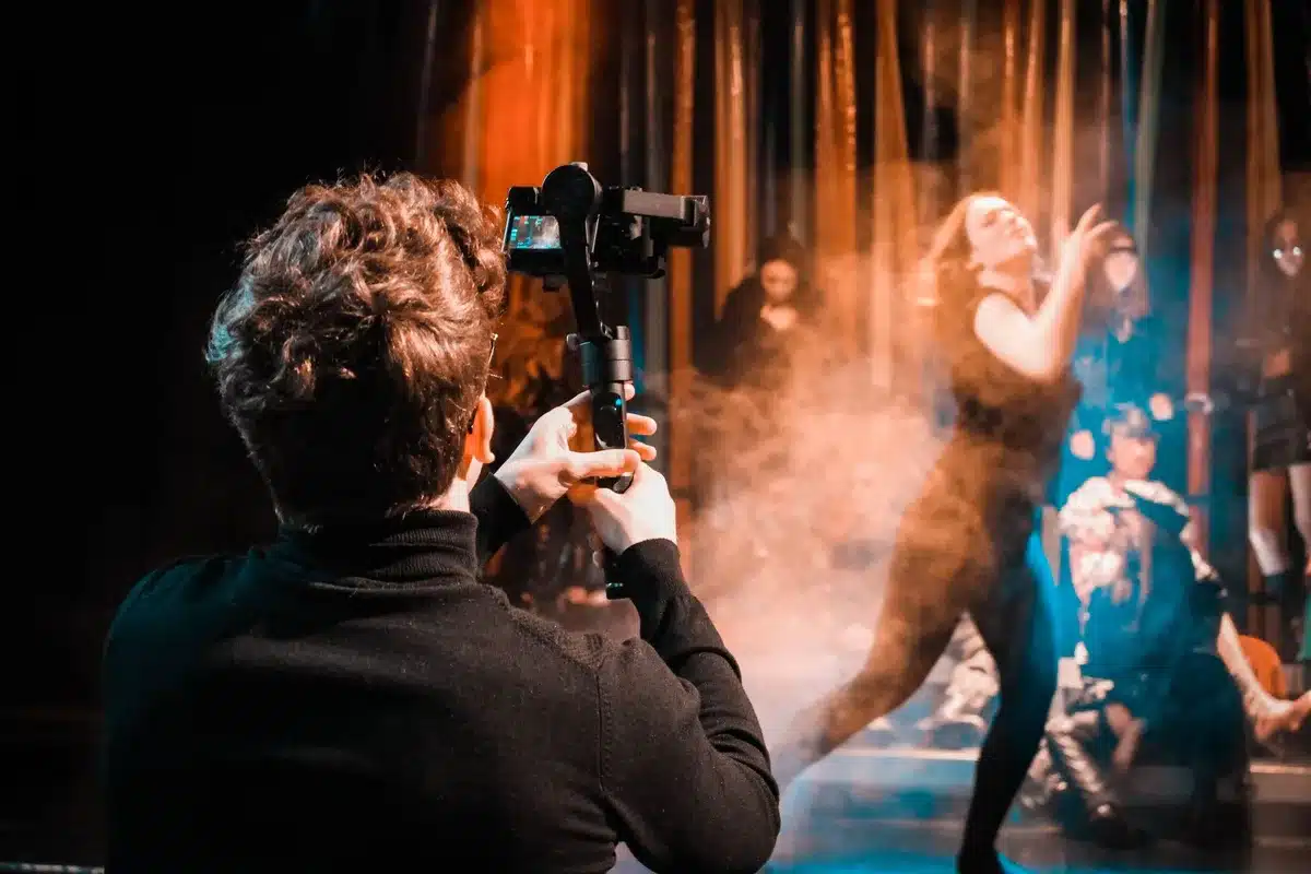 Colorful music video set with dynamic lighting and choreography performance