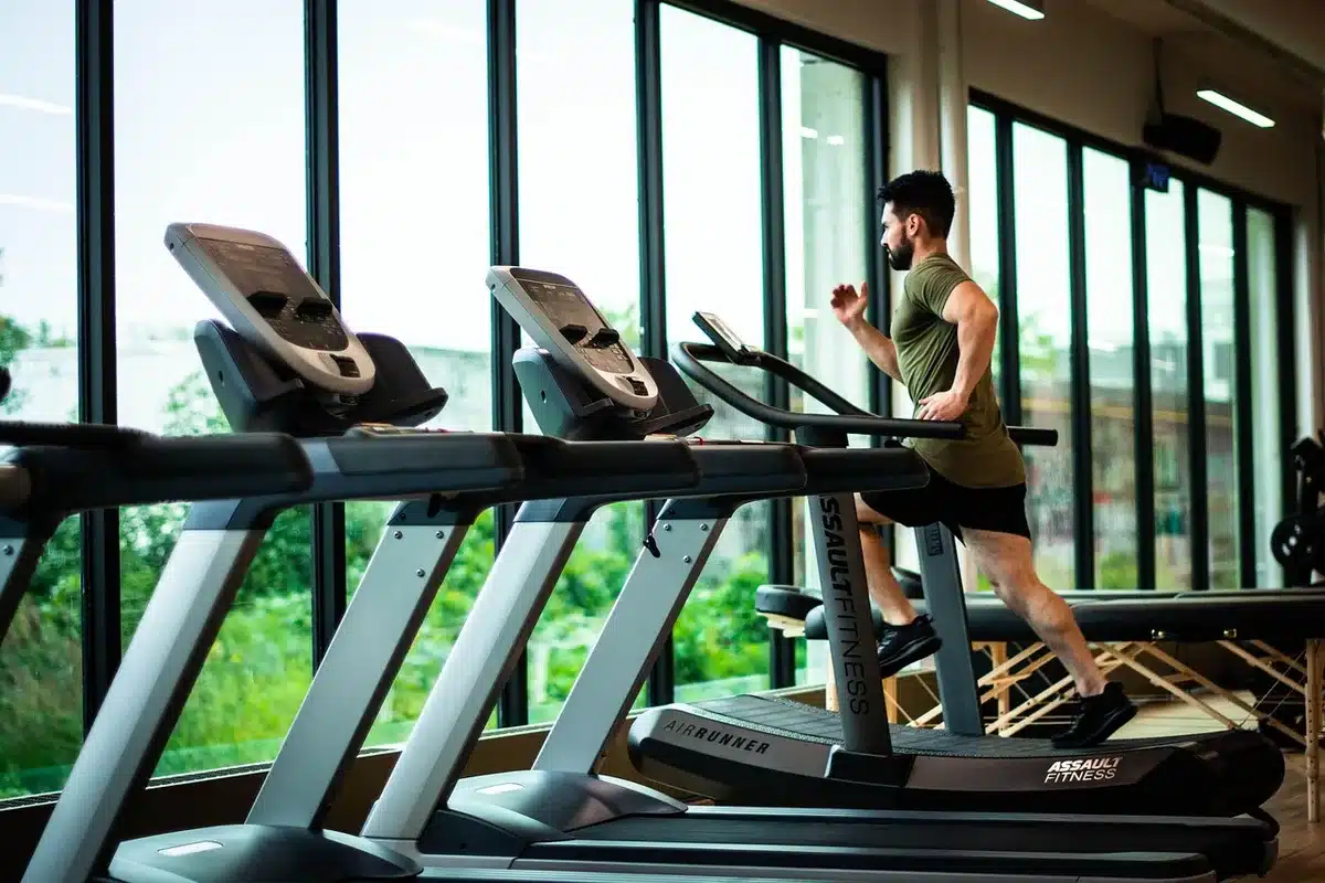 Person running on a treadmill during a cardio workout session