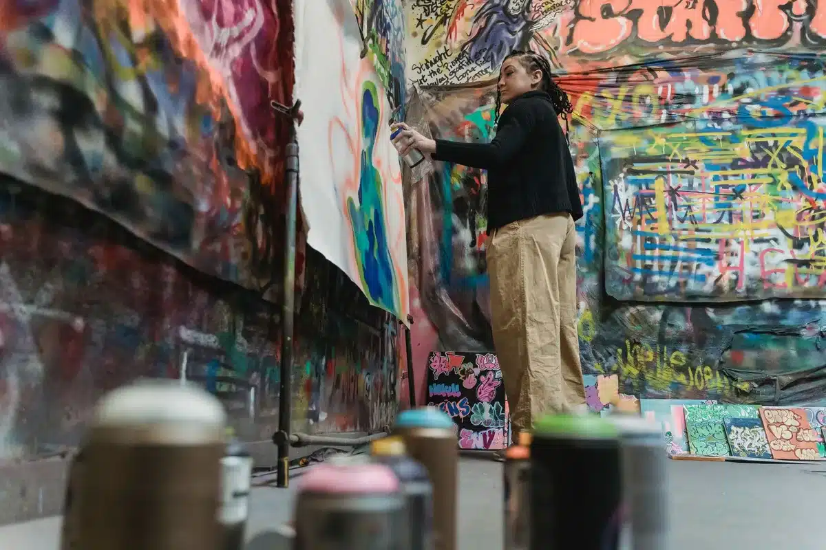 Hip-hop artist working in studio, representing creative control and artistic autonomy