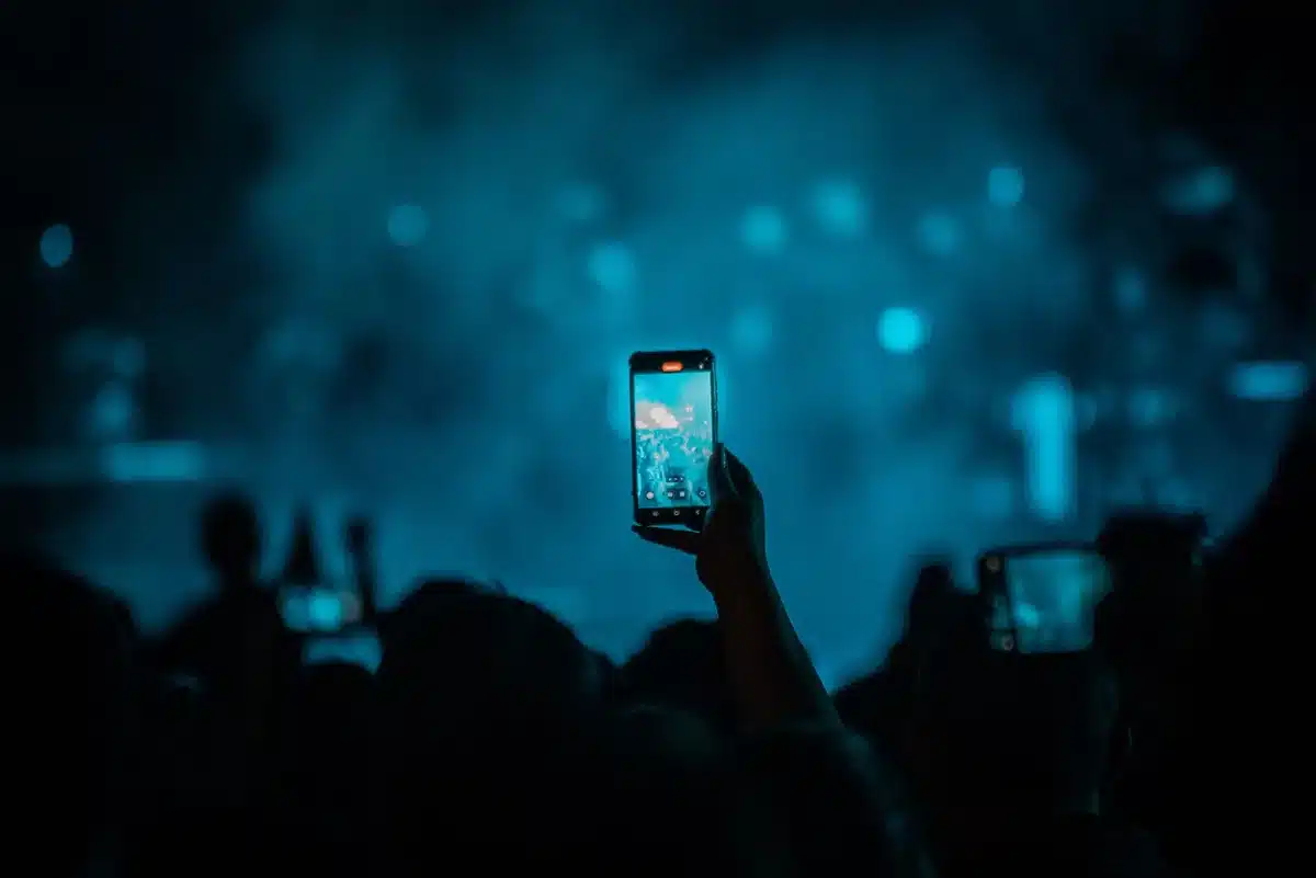 Festival fans discussing online on mobile devices and social media platforms