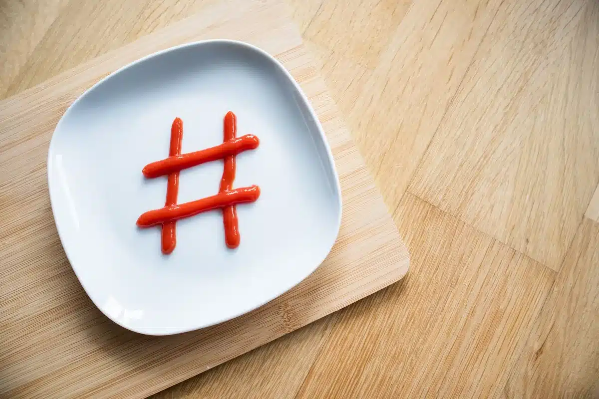 Smartphone screen showing trending hashtags and heated comments on social media