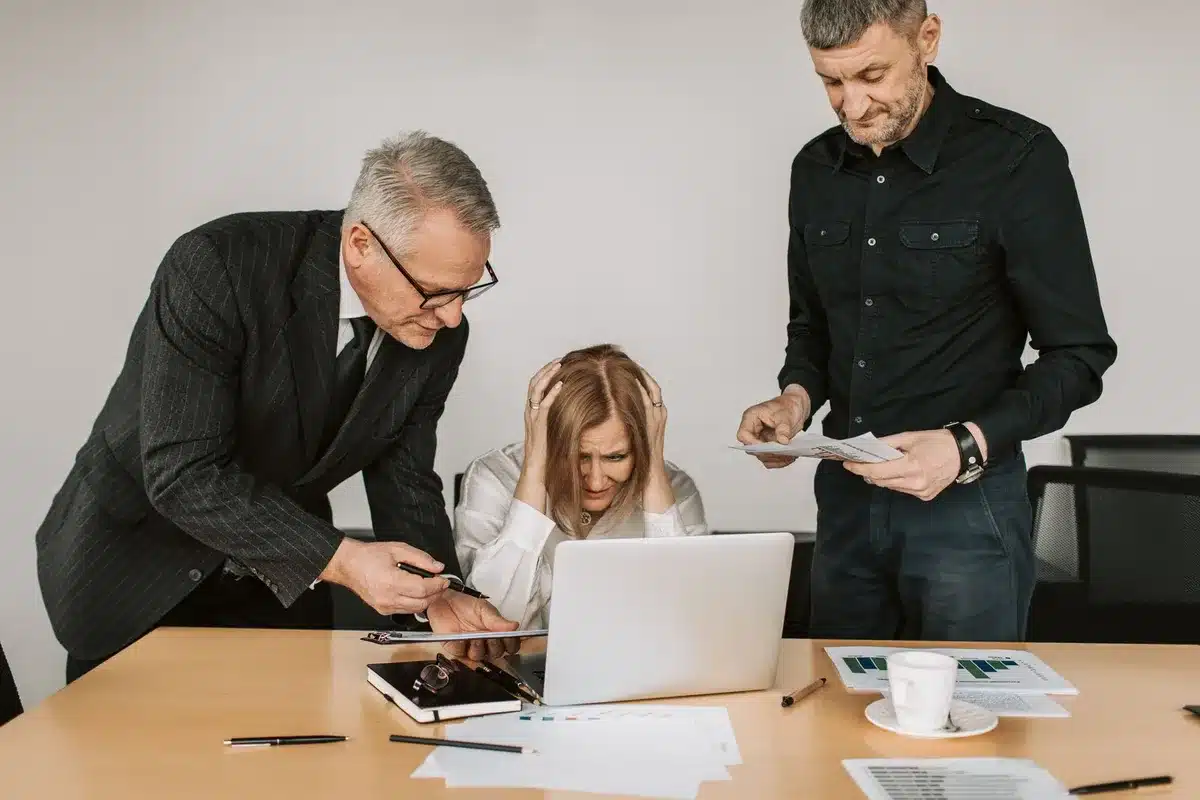 Person in business setting reviewing documents and managing brand reputation strategy