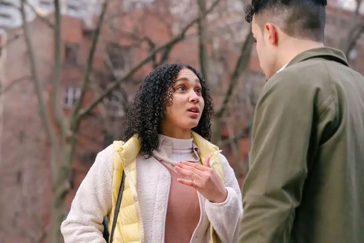 Two people in dialogue, illustrating how to have a neutral conversation about concerning song choices.