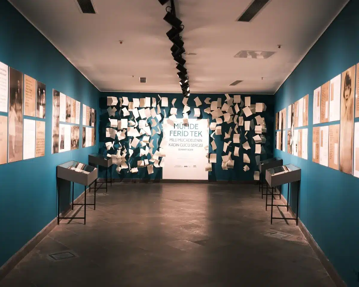 Museum exhibition space with carefully curated displays and archival materials preserved with contextual information