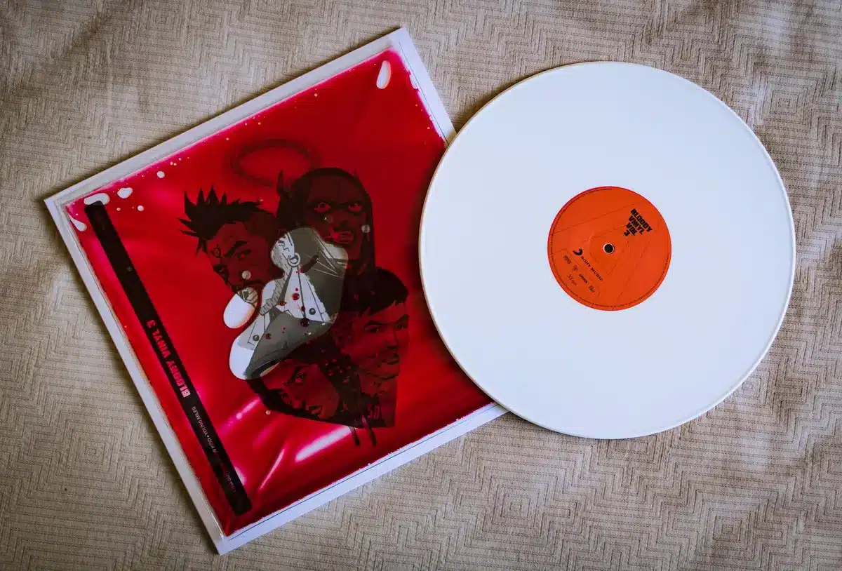 Deluxe vinyl reissue packaging with colored variants, photo books, and collectible memorabilia