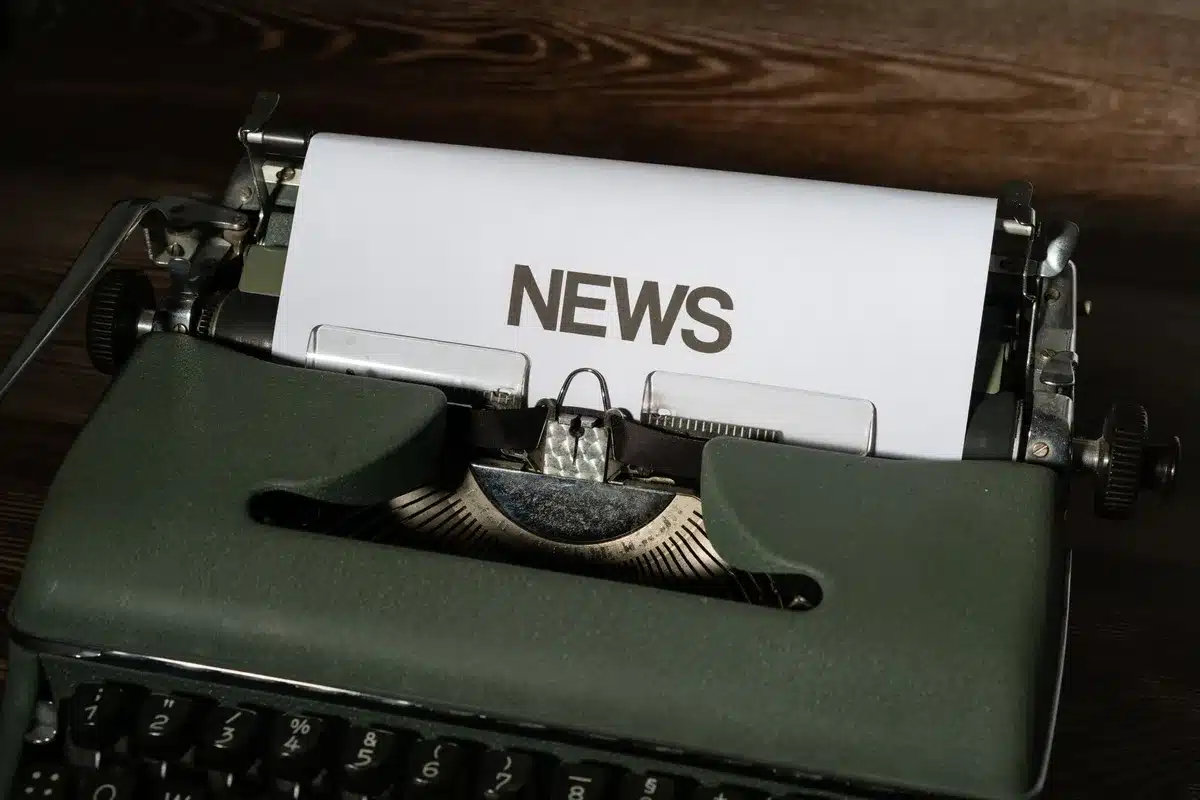 Journalist drafting accurate news copy with sources and verification notes