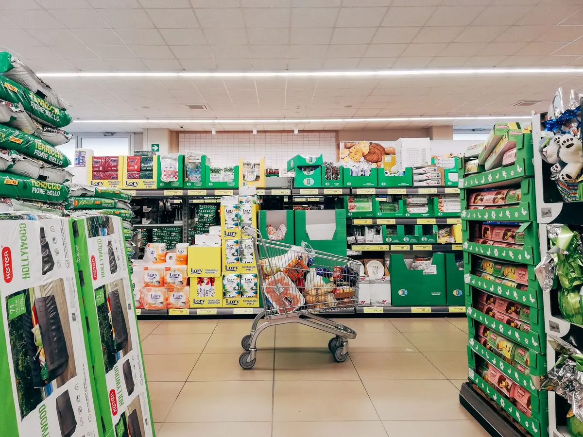 Speakers mounted in a grocery store ceiling broadcasting background music