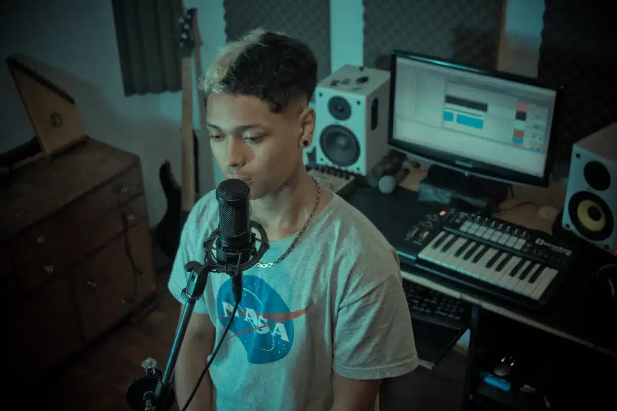 Lo-fi home recording studio setup with microphone and acoustic guitar for intimate vocal recording