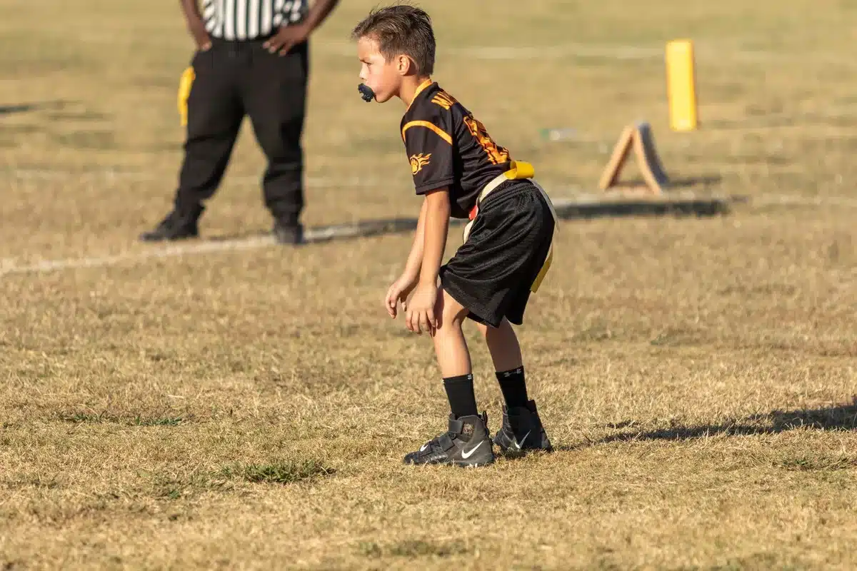 Young athletes playing flag football without heavy protective gear