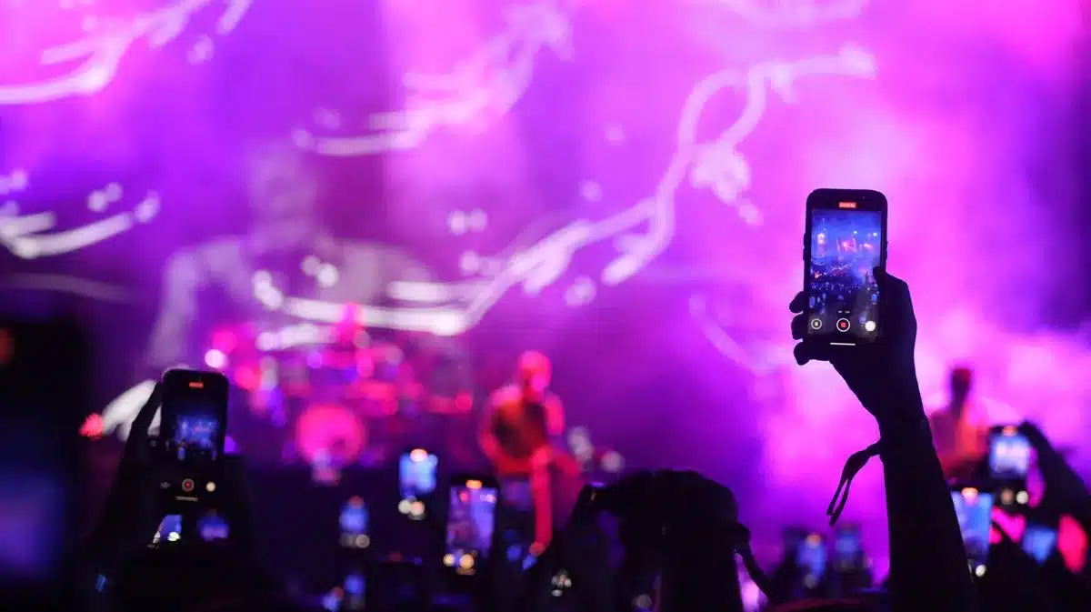 People using smartphones to share messages on social media platforms