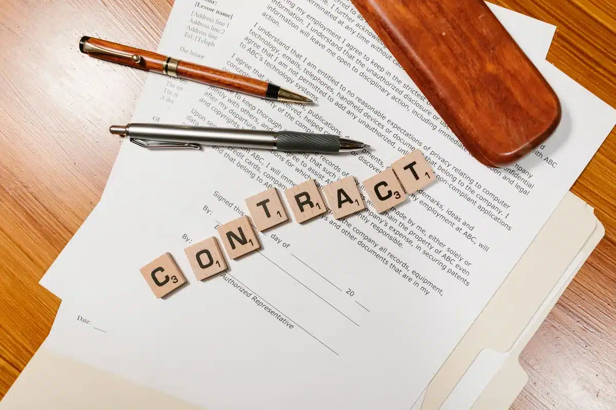 Legal contract document with pen showing restrictive clauses and terms