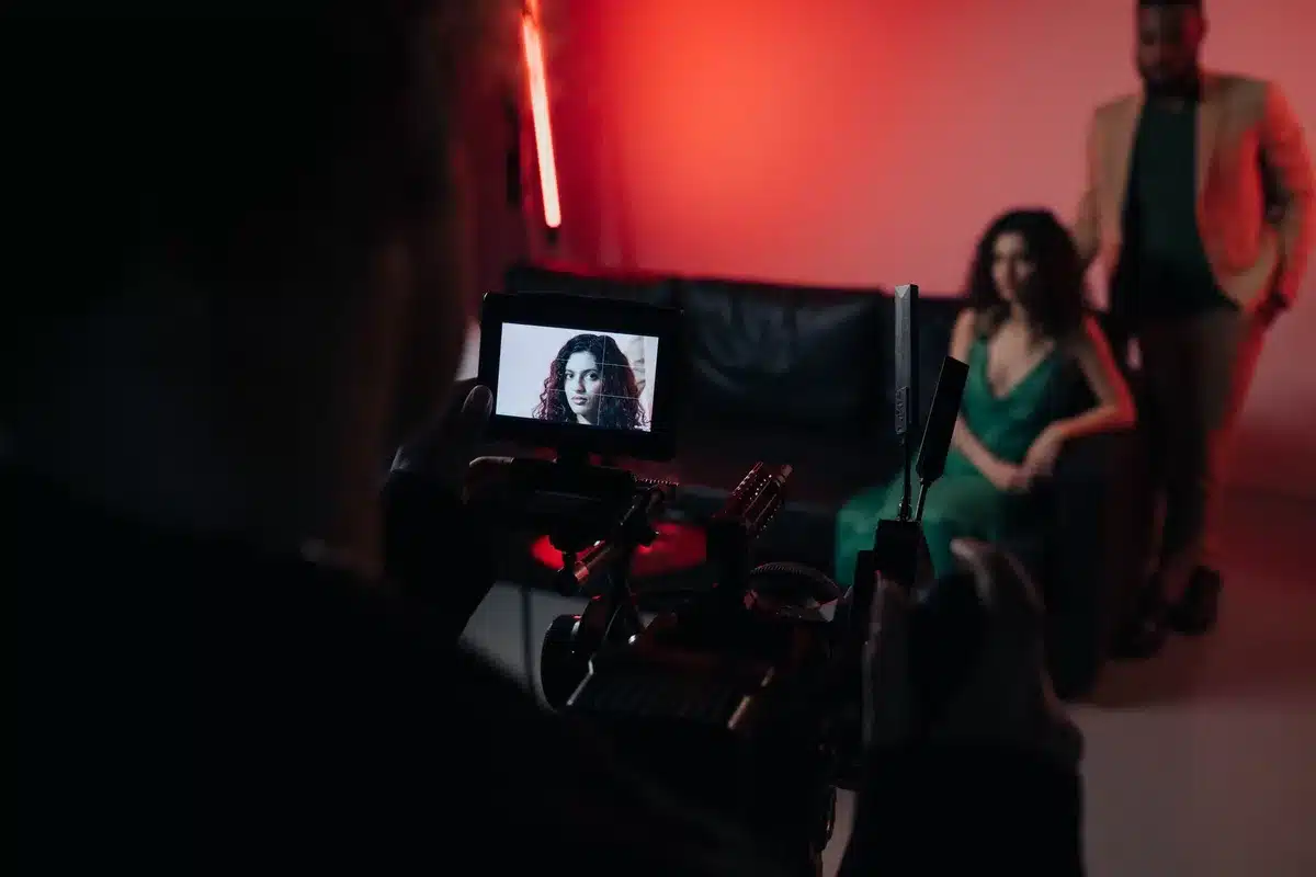 A TV screen showing a dramatic scene with characters interacting