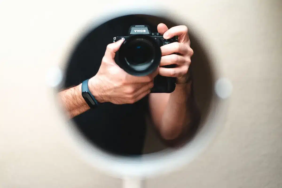 Photographer composing a well-framed shot with careful attention to detail