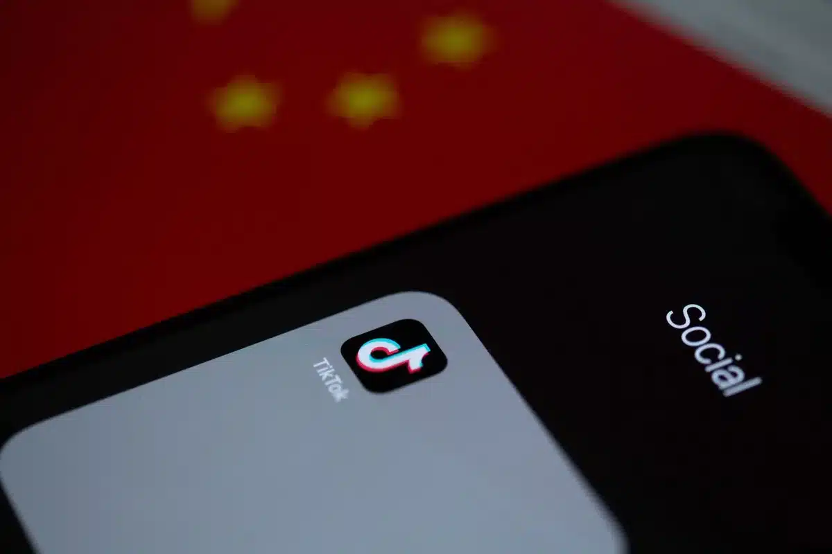 Smartphones displaying TikTok and Twitter apps with viral video content