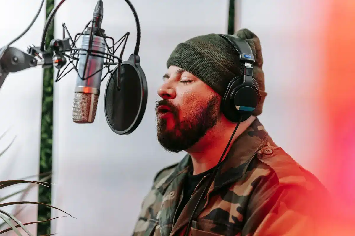 Solo artist recording in studio with microphone and headphones