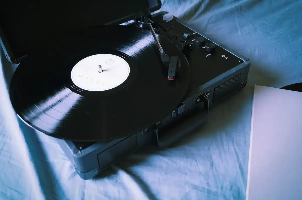 Vinyl record spinning on turntable with warm lighting