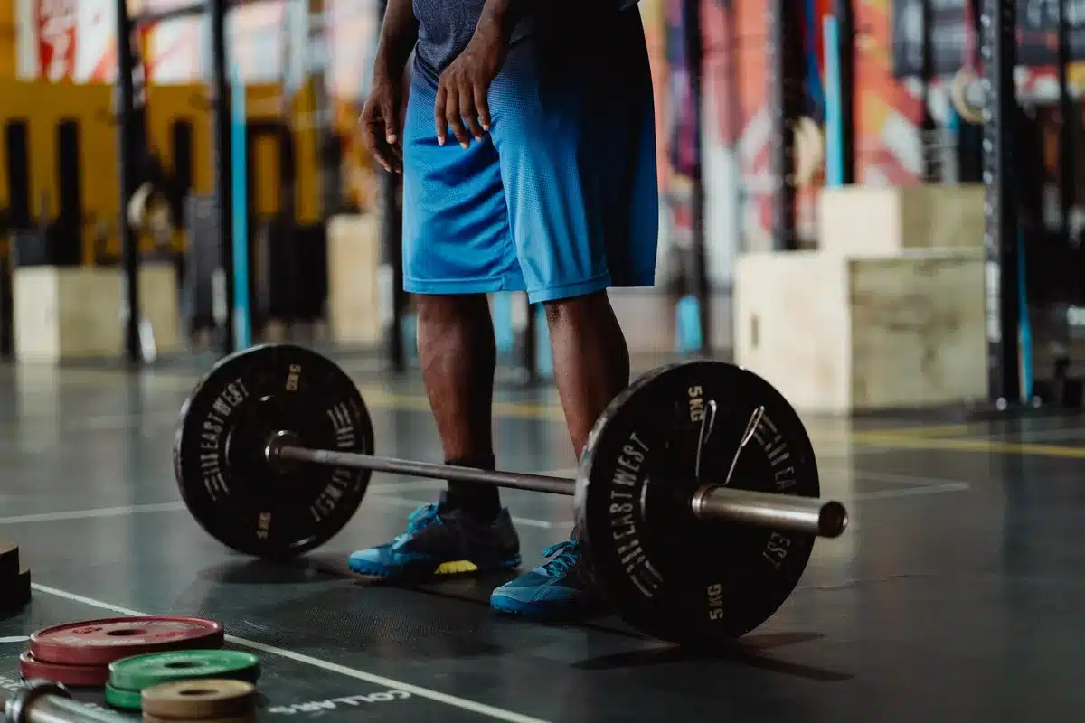 Athlete performing a barbell lift with proper form and control