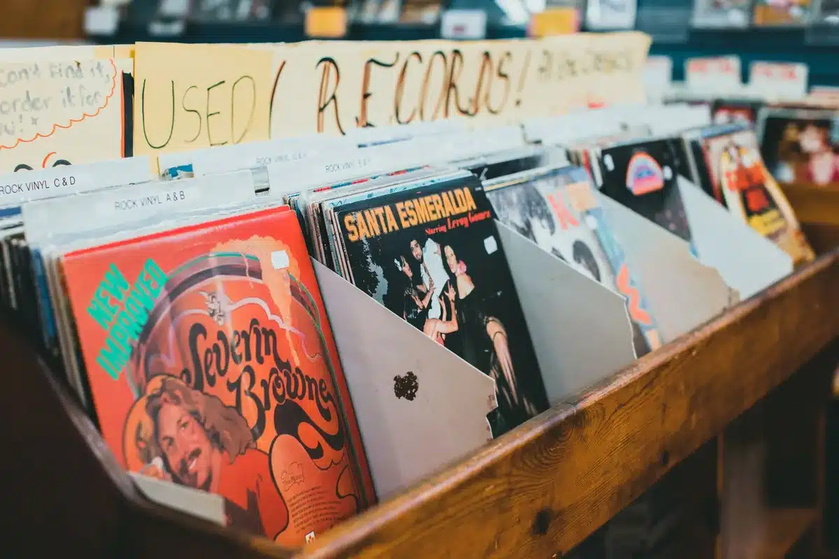 Vinyl records stacked on dusty shelves in a record store