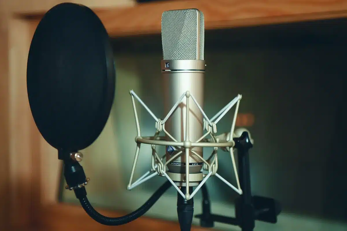 Voice actor speaking into microphone in a professional recording studio