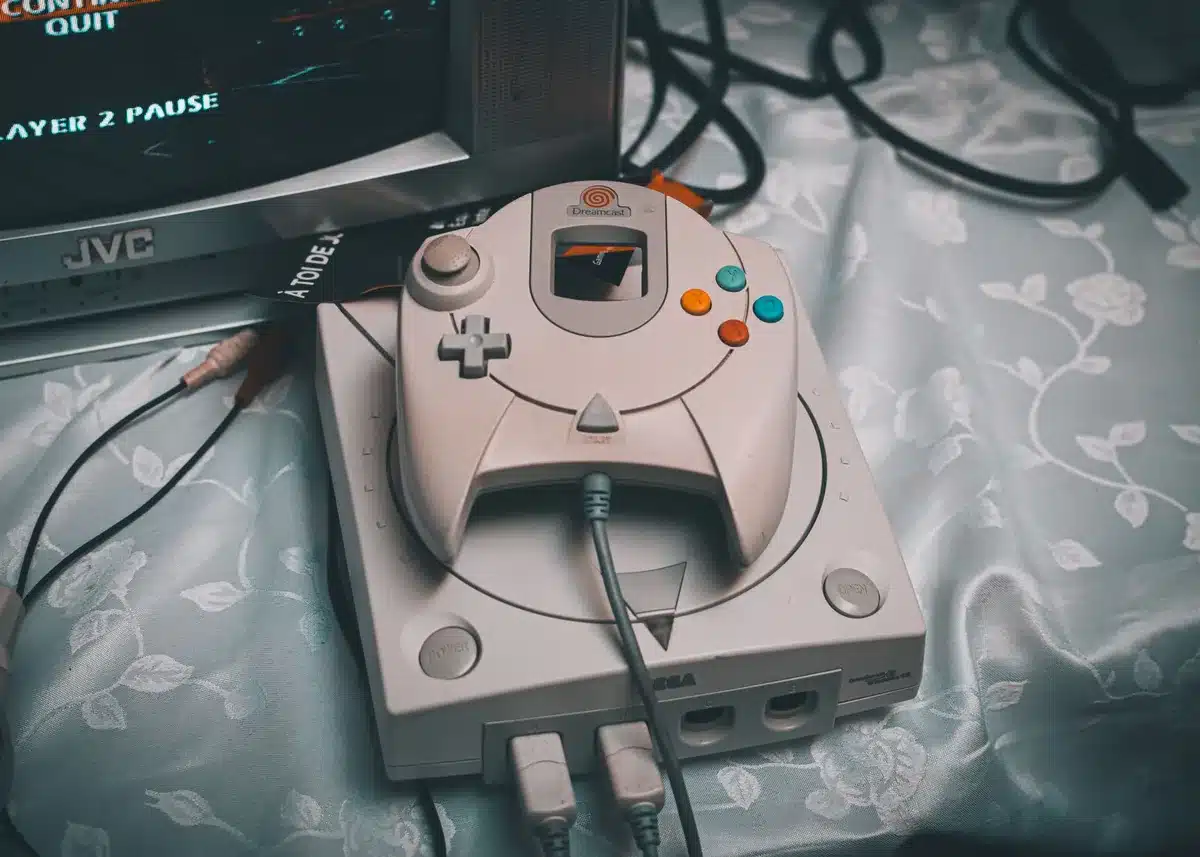 Vintage PlayStation console and skateboard game controller from the 1990s era