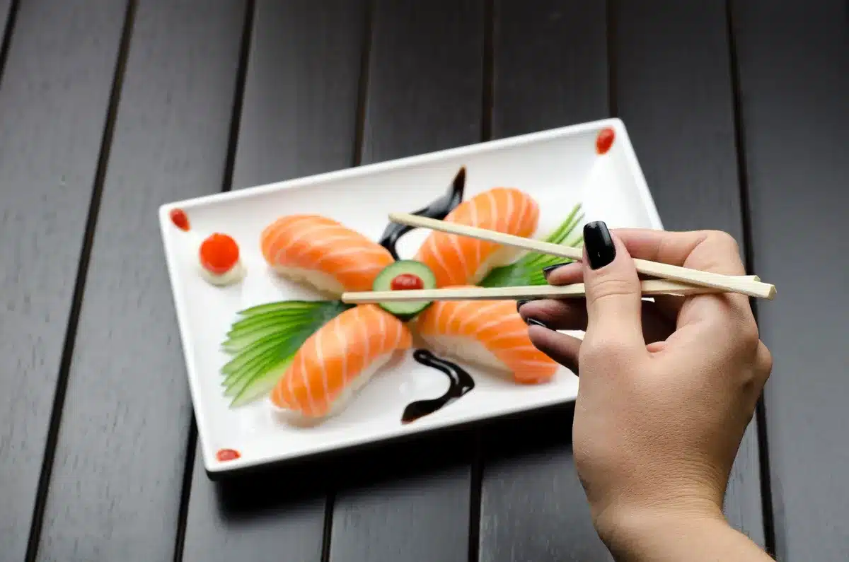 Close-up of carefully plated nigiri and sashimi with artistic presentation