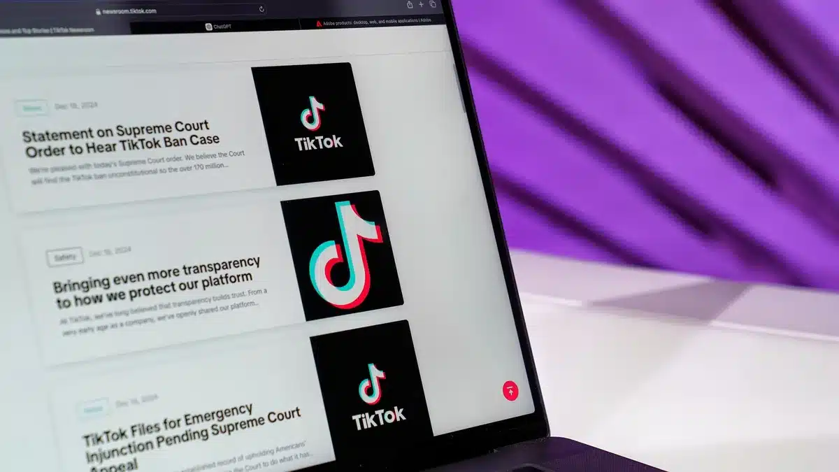 Computer and mobile screens displaying news articles and social media discussions.