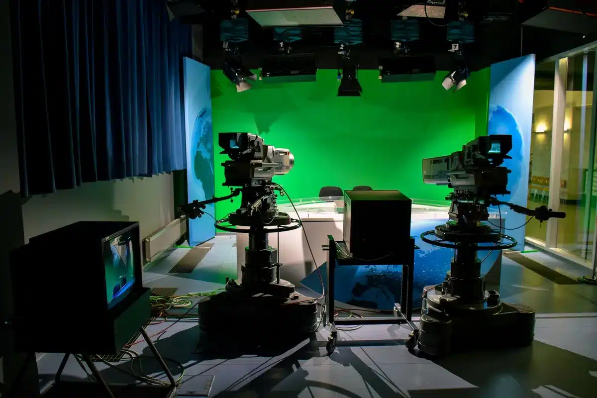 Newsroom with multiple screens showing breaking news coverage