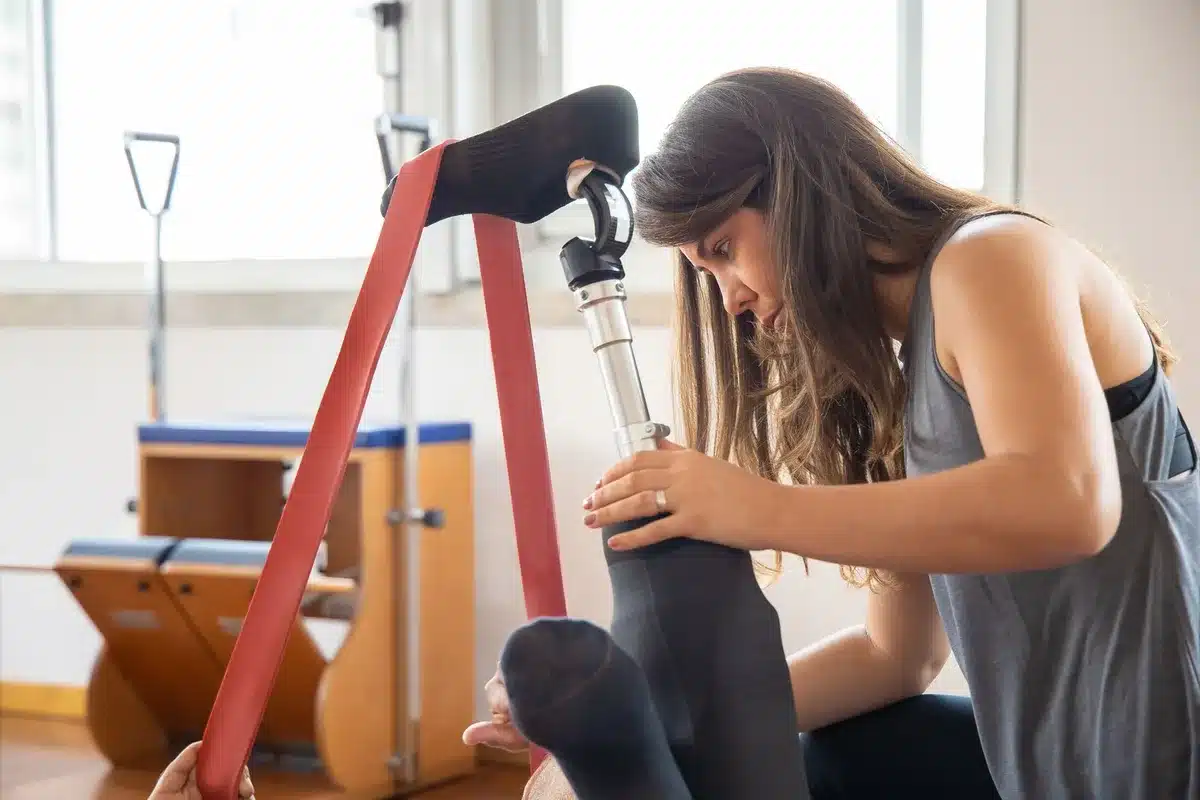 Medical professional assisting a performer with injury recovery and rehabilitation