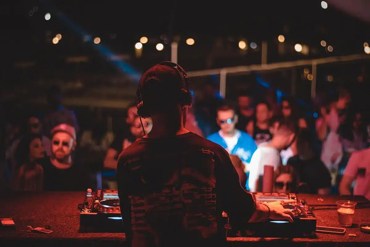 Close-up of a DJ turntable and vinyl in a club setting