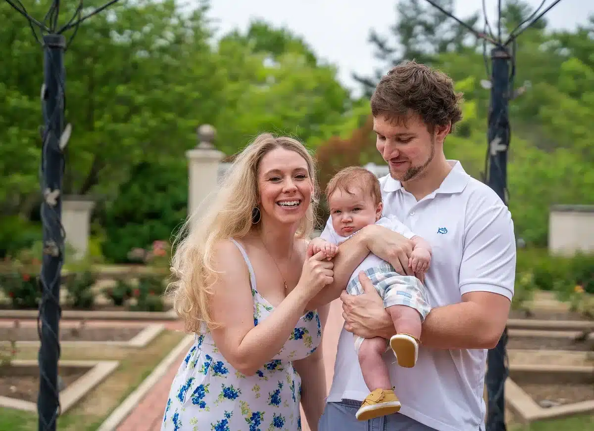 Millennial parent smiling while child hums along to a song