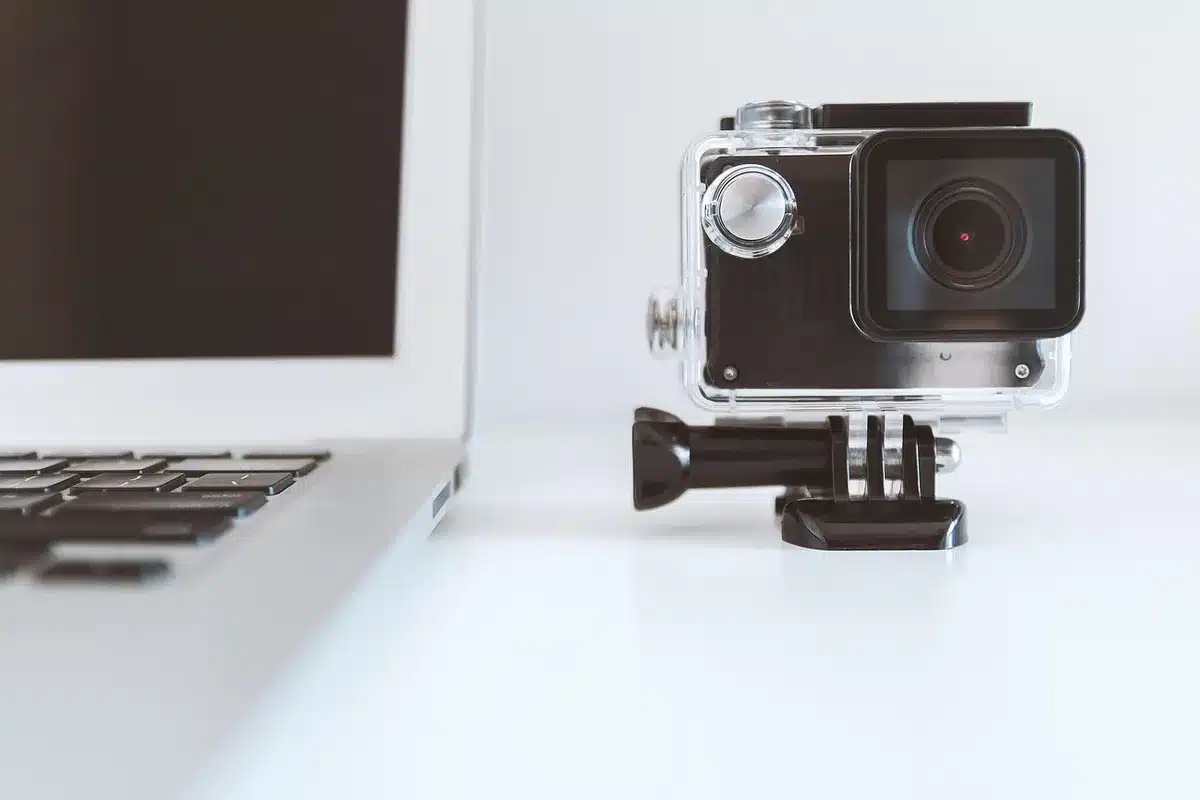 Silhouette of a person holding a camera with a spilled prop, implying a mishap