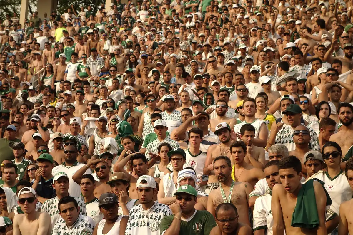 Fans watching and recording a stadium moment on smartphones