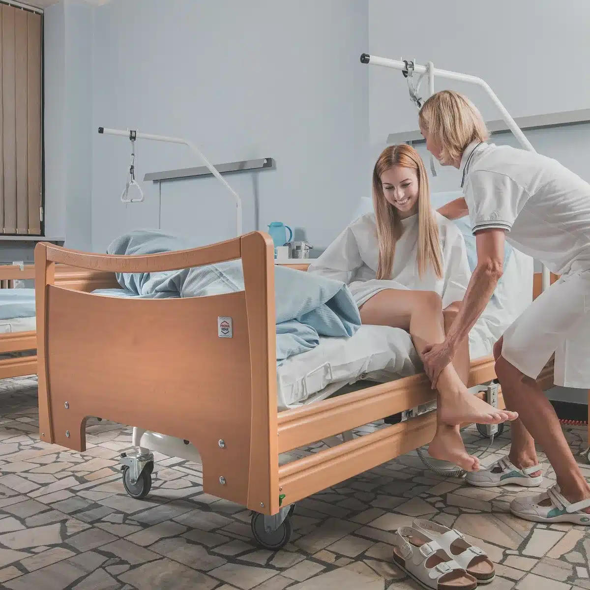 Patient receiving medical care in hospital setting with healthcare professionals