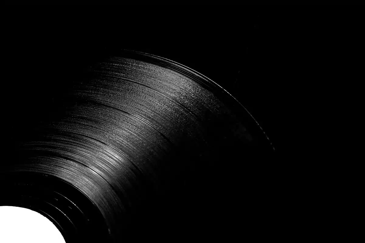 Two classic vinyl album covers propped beside a record player