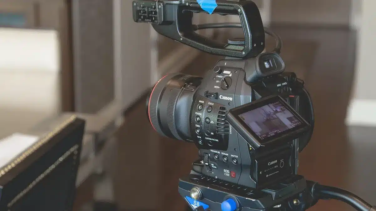 Behind-the-scenes of a music video shoot with camera and lighting