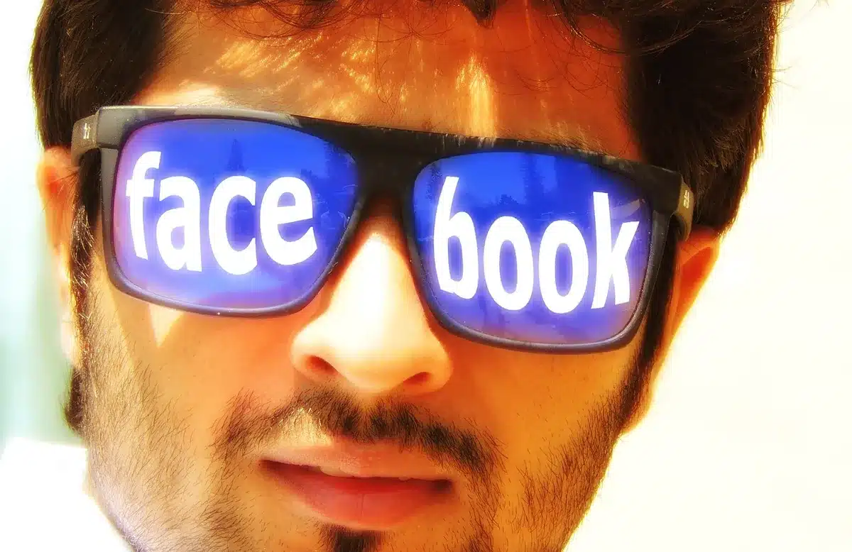 Smartphone showing social media comments and likes