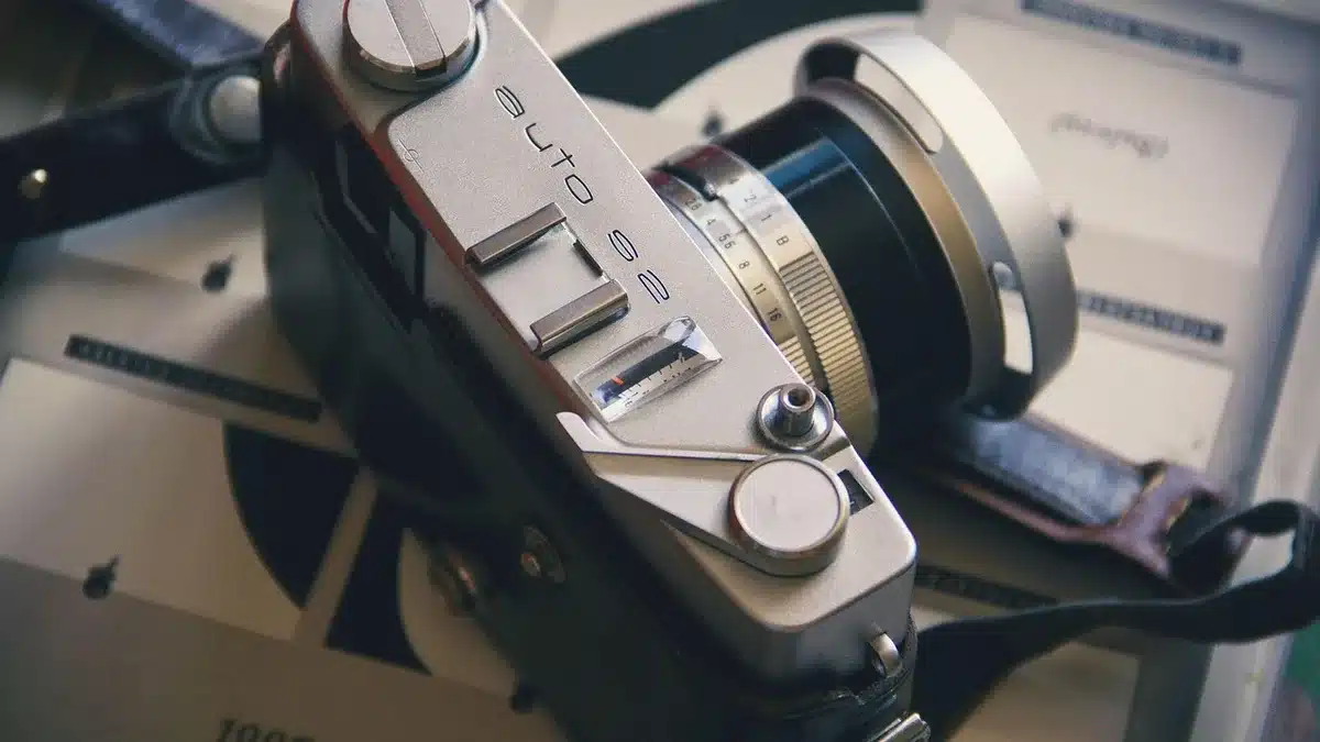 Projectionist threading 35mm film in a theatre projection booth