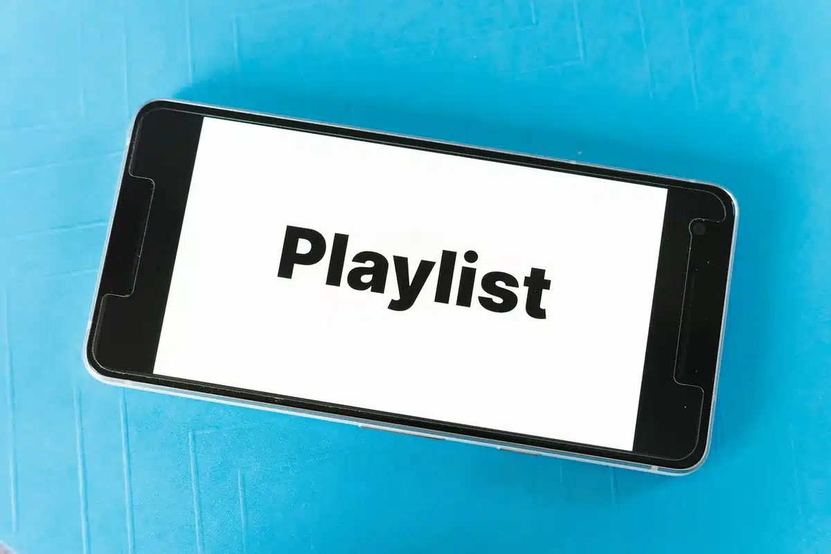 Crowded holiday music playlist on a mobile phone screen