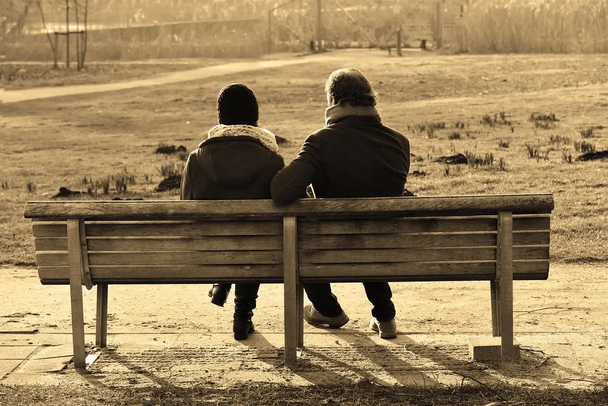Two people having a thoughtful conversation face-to-face