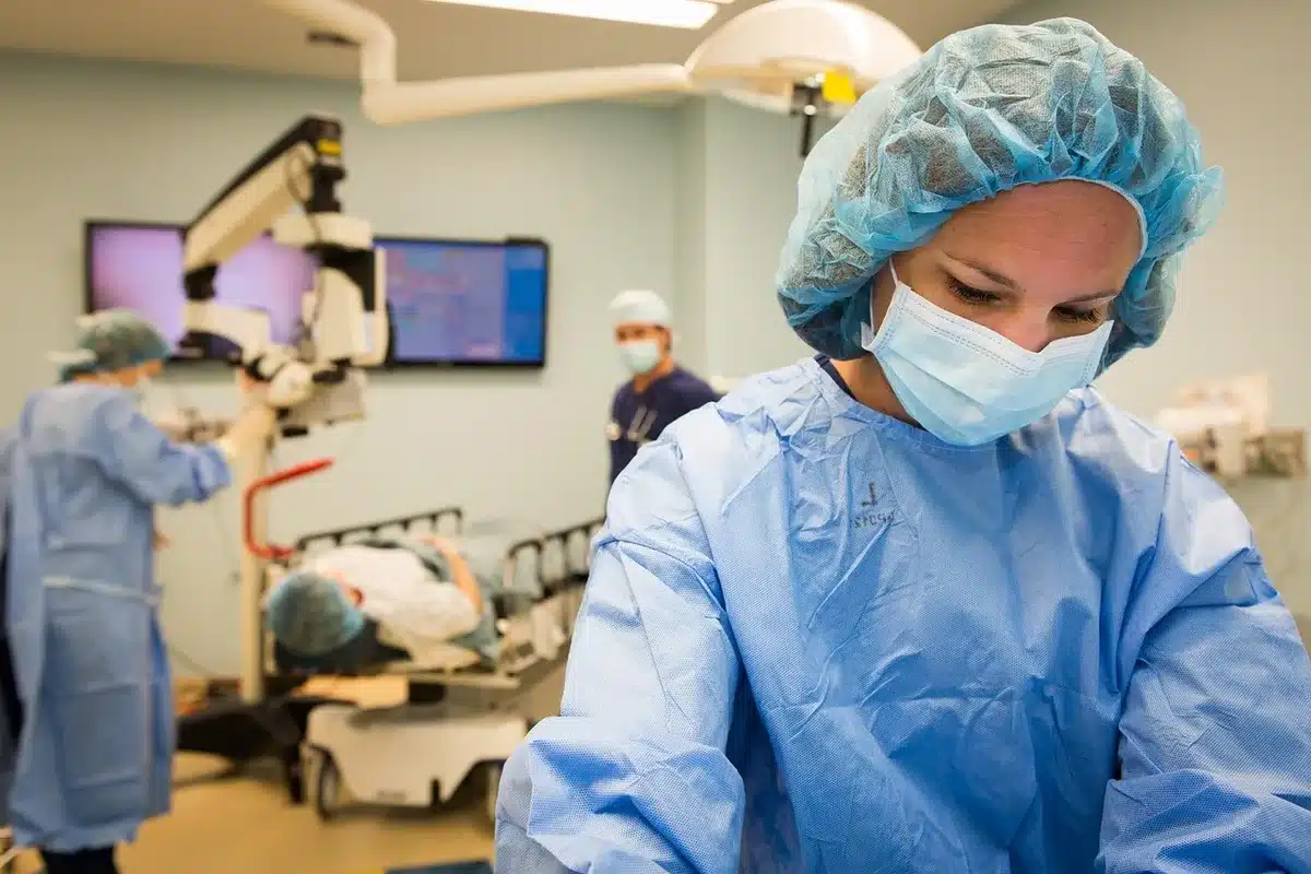 Medical team outside operating theatre preparing for eye surgery