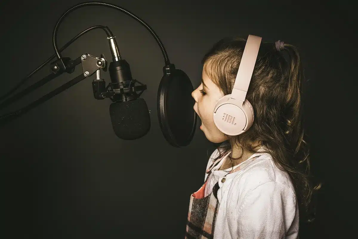 Close-up of a studio microphone in low light suggesting a tense diss track moment