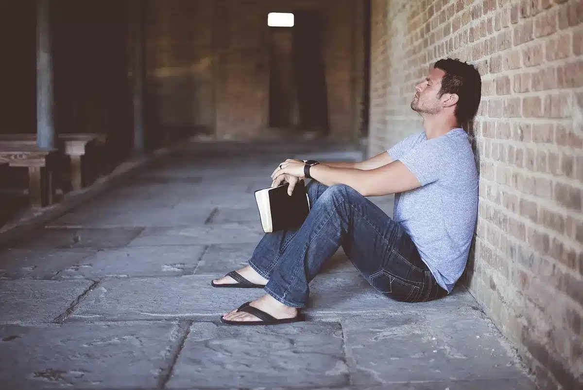 Person pausing thoughtfully before responding during a conversation.