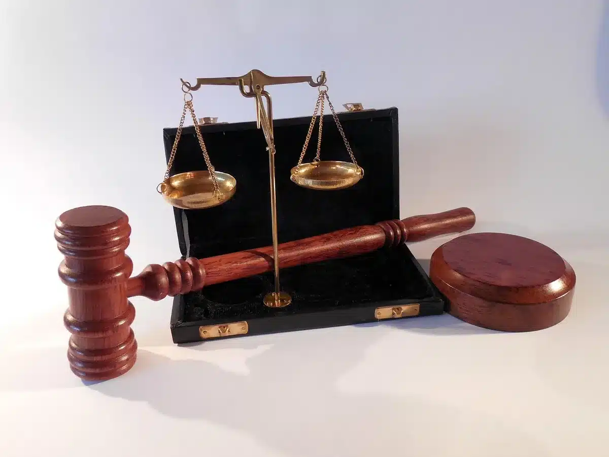 Gavel and legal documents on a courtroom bench during sentencing