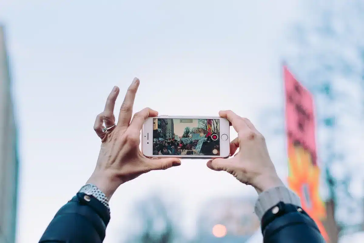 Creator filming a short music video on a smartphone