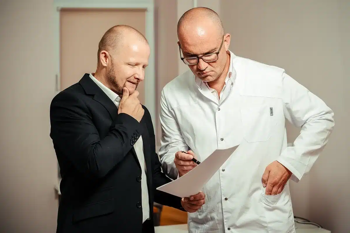 Doctor consulting a patient in a clinic, discussing wellbeing
