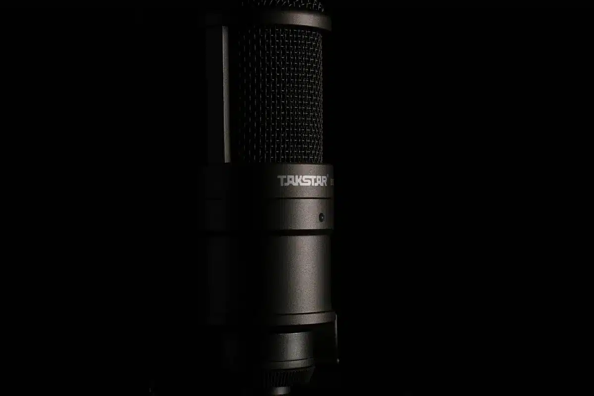 Studio microphone close to a pair of medical jaw bandages on a desk