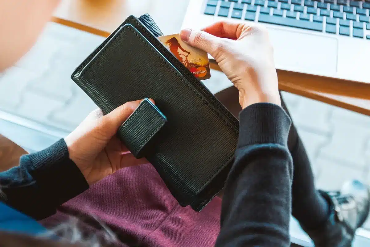Person setting up a crowdfunding page on a laptop
