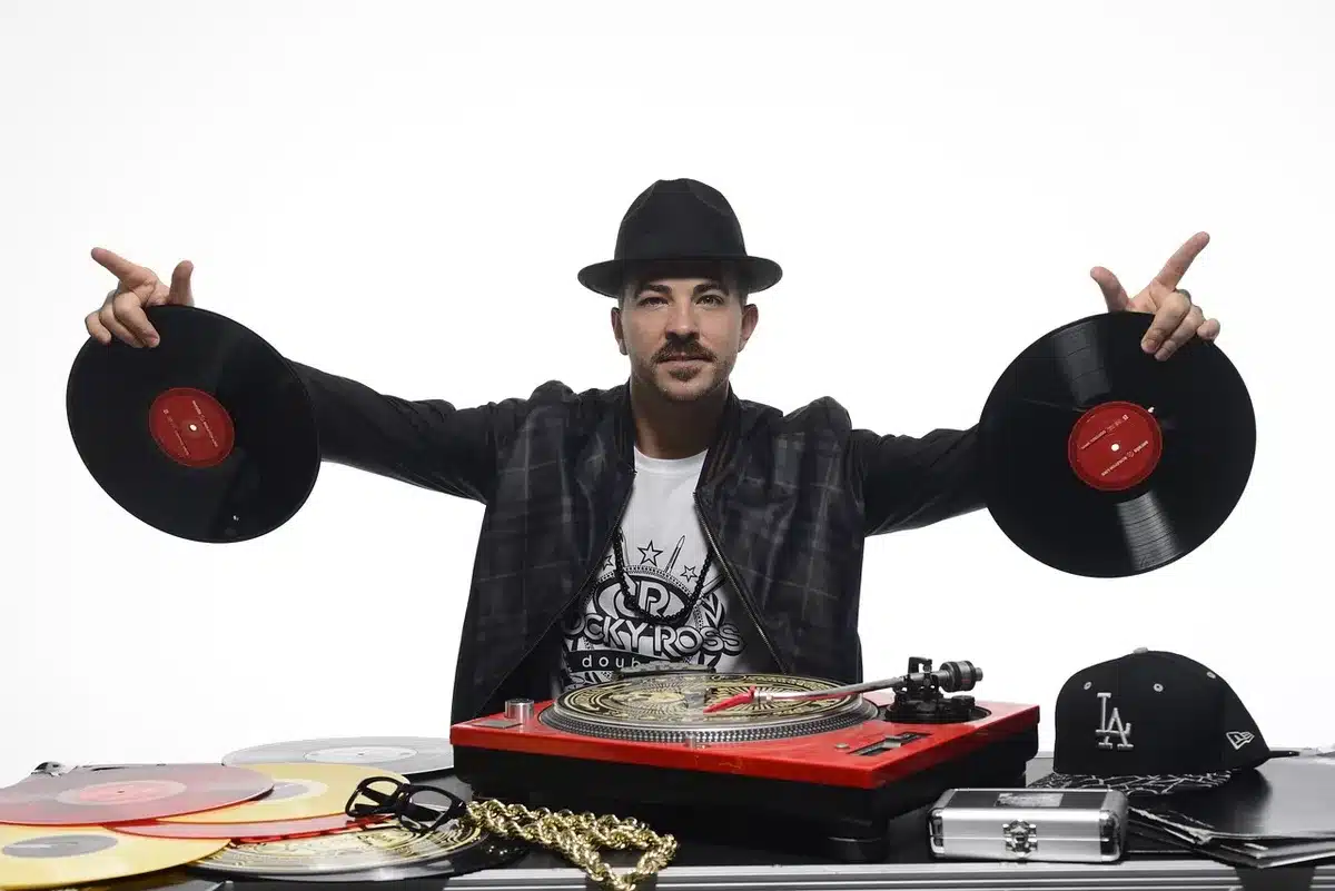 Vinyl record spinning on a turntable in a recording studio setting